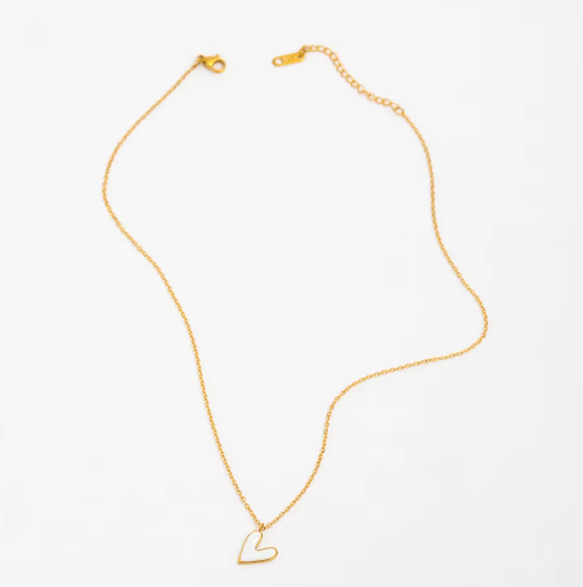 Gold necklace with a heart-shaped pendant on a white background