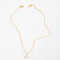 Gold necklace with a heart-shaped pendant on a white background